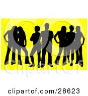 Poster, Art Print Of Black Silhouetted Group Of Seven Men And Women Standing Together Over Yellow