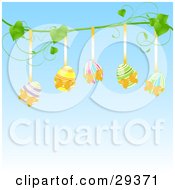 Poster, Art Print Of Five Colorful Easter Eggs Hanging From Golden Ribbons On A Green Vine Over A Blue Background