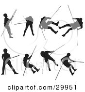 Clipart Illustration Of A Series Of Silhouetted Rock Climbers Using Ropes And Climbing Techniques To Descend And Ascend A Mountain by Paulo Resende #COLLC29951-0047