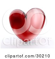 Poster, Art Print Of Shiny Red Glass Heart Over White