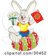 Poster, Art Print Of Dressed Bunny Rabbit Holding Spring Daisy Flowers And A Greeting Card While Sitting On A Colorful Easter Egg