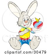 Poster, Art Print Of Happy Little Bunny Rabbit In Clothes Sitting And Painting An Apple Like An Easter Egg
