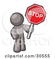 Gray Man Holding A Red Stop Sign
