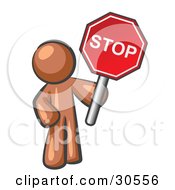 Brown Man Holding A Red Stop Sign