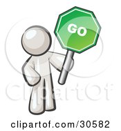 Poster, Art Print Of White Man Holding Up A Green Go Sign On A White Background