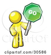 Poster, Art Print Of Yellow Man Holding Up A Green Go Sign On A White Background