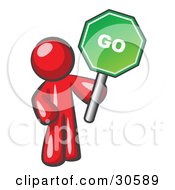 Poster, Art Print Of Red Man Holding Up A Green Go Sign On A White Background