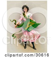 Poster, Art Print Of Vintage Victorian St Patricks Day Scene Of A Young Lady In A Pink Dress Holding The Traditional Irish Flag Circa 1903