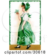 Poster, Art Print Of Vintage Victorian St Patricks Day Scene Of A Young Irish Lady In A Green Dress And Bonnet Carrying A Small Plant Circa 1907