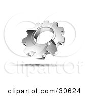 Clipart Illustration Of A Pre Made Logo Of One Shiny Silver Cog by beboy