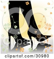 Womans Silhouetted Feet In Stiletto Heels On A Reflective Surface With A Gradient Yellow Background And Green And Orange Flowers