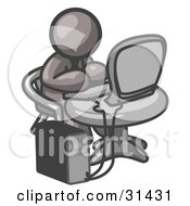 Clipart Illustration Of A Gray Man Working On A Desktop Computer On A Table