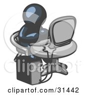 Clipart Illustration Of A Navy Blue Man Working On A Desktop Computer On A Table