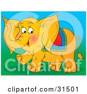 Clipart Illustration Of A Friendly Orange Circus Elephant With A Blanket On Its Back Walking On Grass On A White Background by Alex Bannykh