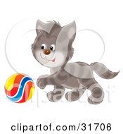 Poster, Art Print Of Playful Cute Gray Striped Kitten Reaching His Paw Towards A Colorful Ball