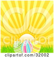 Clipart Illustration Of A Sunny Sky Behind Three Striped Easter Eggs In Grass