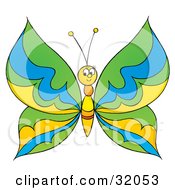 Clipart Illustration Of A Friendly Butterfly With Green Blue And Yellow Patterned Wings