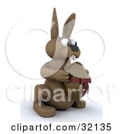 Clipart Illustration Of A Brown 3d Bunny Rabbit Holding A Chocolate Easter Egg With A Bow Around It by KJ Pargeter