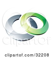 Reflective Green 3d Ring Resting On A Chrome Ring On A White Background