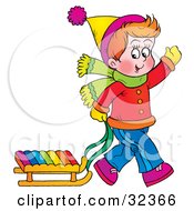 Poster, Art Print Of Boy Waving While Pulling His Sled Behind Him On A Winter Day