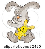 Clipart Illustration Of A Friendly Gray Bunny Sitting With A Stuffed Animal