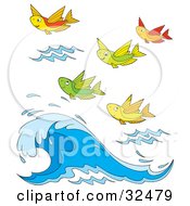 Group Of Colorful Flying Fish Above A Wave