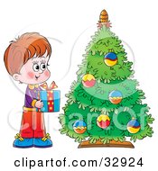 Poster, Art Print Of Giving Boy Holding A Present By A Christmas Tree