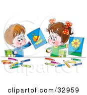 Little Boy And Girl Holding Up Their Drawings Of A Flower And Boat