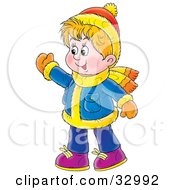 Friendly Boy Waving Wearing Winter Clothes