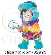 Friendly Boy In Winter Clothing Moving Snow With A Shovel