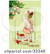 Little Victorian Girl Hugging Her White Cat And Standing By Toys Near A Christmas Tree On A Green Background With Greeting Text