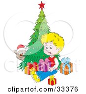 Poster, Art Print Of Kitty Wearing A Santa Hat Peeking Around A Christmas Tree And Watching A Blond Boy Open Presents