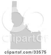 Clipart Illustration Of A Gray State Silhouette Of Idaho United States On A White Background