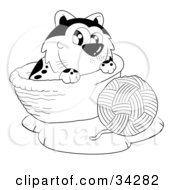 Clipart Illustration Of A Cute Cat In A Basket Playing With A Ball Of Yarn