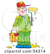 Friendly Male Painter Dressed In Green Holding A Dripping Paint Bucket And Holding A Paint Roller With Yellow Paint