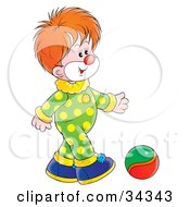 Poster, Art Print Of Adorable Red Haired Clown In A Green And Yellow Polka Dot Costume Kicking A Ball