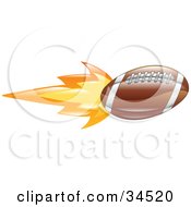 Clipart Illustration Of An American Football On Fire by AtStockIllustration