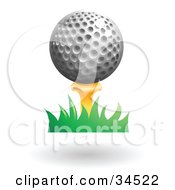Poster, Art Print Of Golf Ball Resting On Top Of A Yellow Tee In Grass