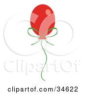 Clipart Illustration Of A Floating Red Christmas Balloon With A Green Bow And String