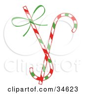 Poster, Art Print Of Two Christmas Candy Canes One With A Green Bow