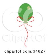 Clipart Illustration Of A Floating Green Christmas Balloon With A Red Bow And String