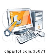 Clipart Illustration Of A Wrench Over A Desktop Computer