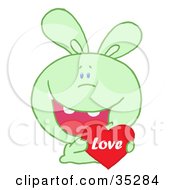 Poster, Art Print Of Caring Green Rabbit Laughing And Holding A Red Heart Love Valentine