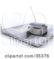 Clipart Illustration Of A 3d Personal Cam Corder Resting On Top Of A Laptop Computer