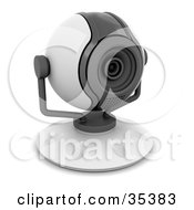 Compact White And Gray Web Cam Facing Slightly Right