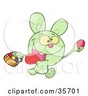 Poster, Art Print Of Green Bunny Running And Holding Up An Egg And Carrying A Basket During An Easter Egg Hunt