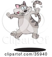 Poster, Art Print Of Hyperactive Gray Striped Cat Leaping Up Over A Shadow