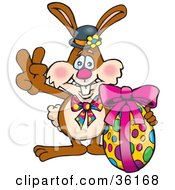 Poster, Art Print Of Bunny Rabbit Signaling The Peace Sign And Standing With An Easter Egg