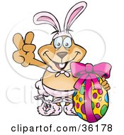 Poster, Art Print Of Dog Wearing Bunny Ears And Slippers Signaling The Peace Sign And Standing With An Easter Egg