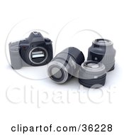 Three Camera Lenses Resting Beside A Body